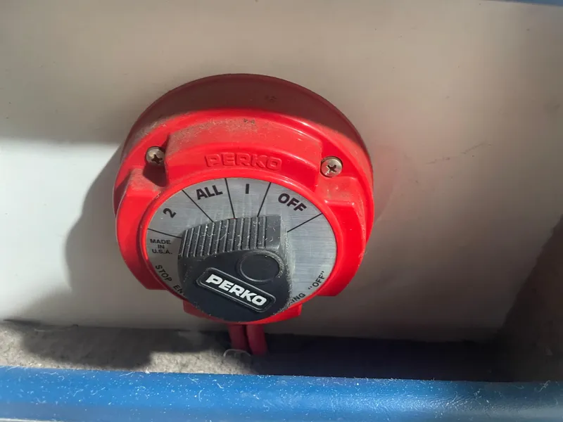 Slide: The Image of Red Perko battery switch on a 1993 Regal Ambassador 233 boat. - 44
