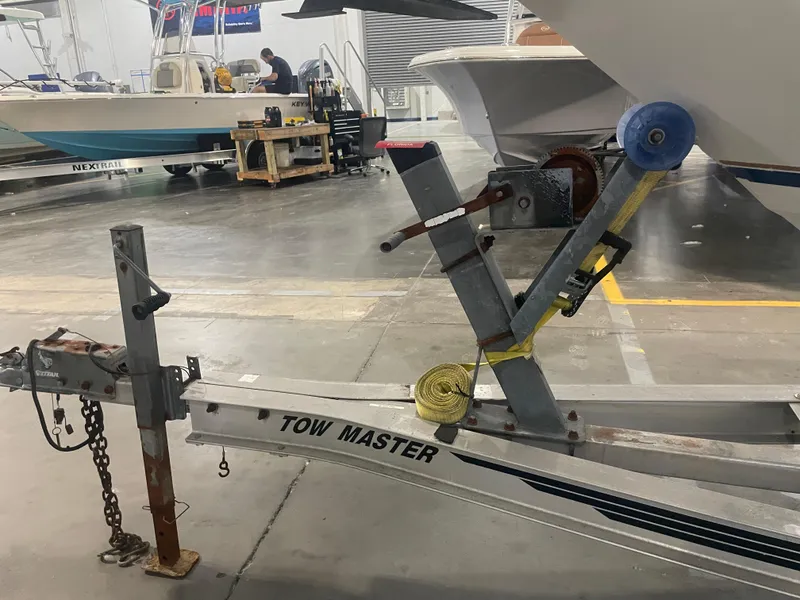 Slide: The Image of Trailer hitch and winch system for 1993 Regal Ambassador 233 boat in a workshop. - 45