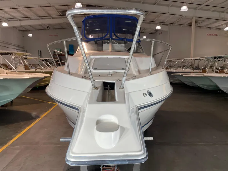 Slide: The Image of 1993 Regal Ambassador 233 boat in indoor storage, front view. - 6