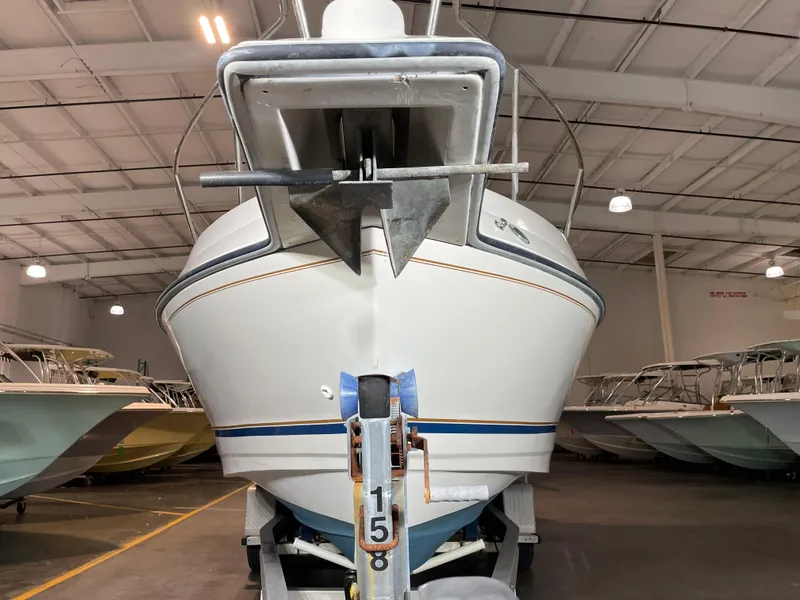 Slide: The Image of Front view of a 1993 Regal Ambassador 233 boat in a storage facility. - 7