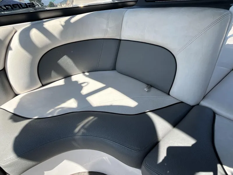 Slide: The Image of 2009 Supra Launch 24 SSV interior seating with gray and white upholstery. - 17