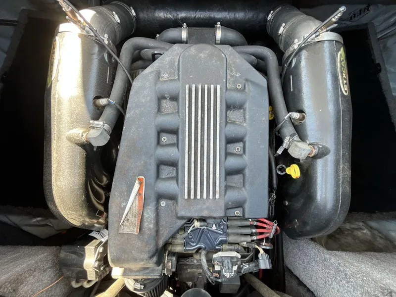 Slide: The Image of 2009 Supra Launch 24 SSV engine, top view, showcasing intricate mechanical components. - 20