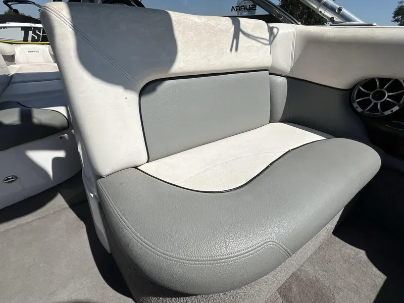 Slide: The Image of 2009 Supra Launch 24 SSV boat interior with gray and white seating. - 23