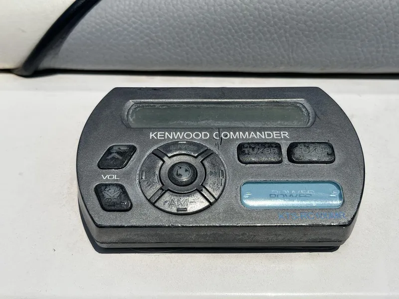 Slide: The Image of Kenwood Commander audio control panel in a 2009 Supra Launch 24 SSV boat. - 24