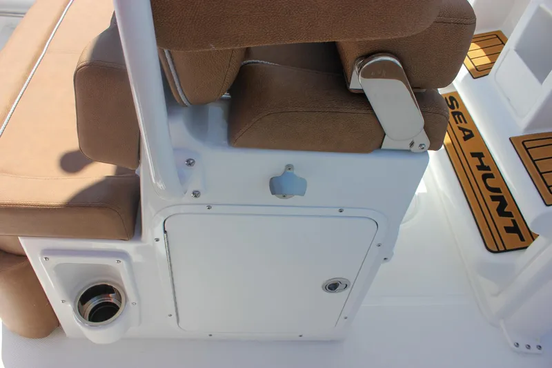 Slide: The Image of 2026 Sea Hunt Ultra 245 SE boat seating and storage area. - 12