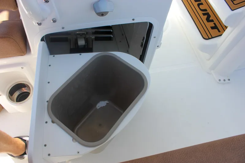 Slide: The Image of Open storage compartment on 2026 Sea Hunt Ultra 245 SE boat interior. - 13