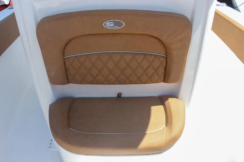 Slide: The Image of 2026 Sea Hunt Ultra 245 SE boat seat with tan upholstery and diamond stitching. - 20