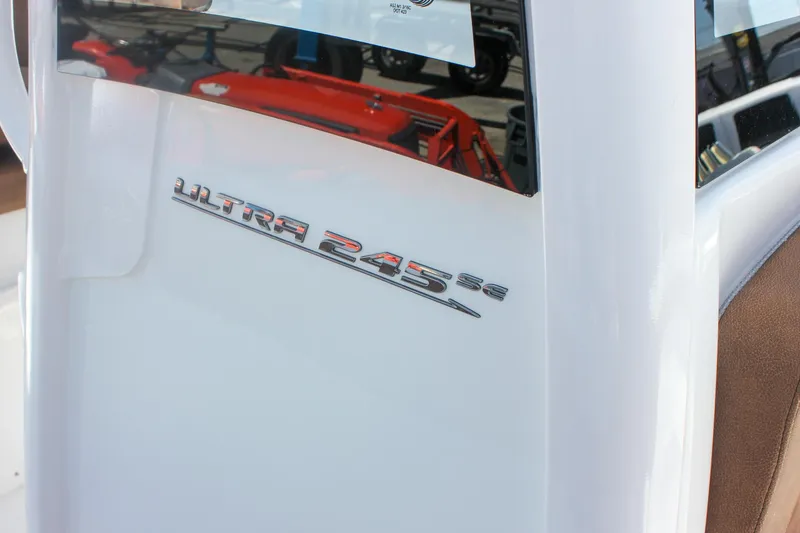 Slide: The Image of 2026 Sea Hunt Ultra 245 SE boat logo on white surface. - 24
