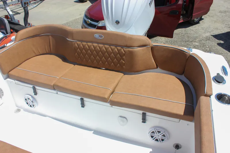 Slide: The Image of Luxurious seating on 2026 Sea Hunt Ultra 245 SE boat, featuring tan upholstery and diamond stitching. - 6