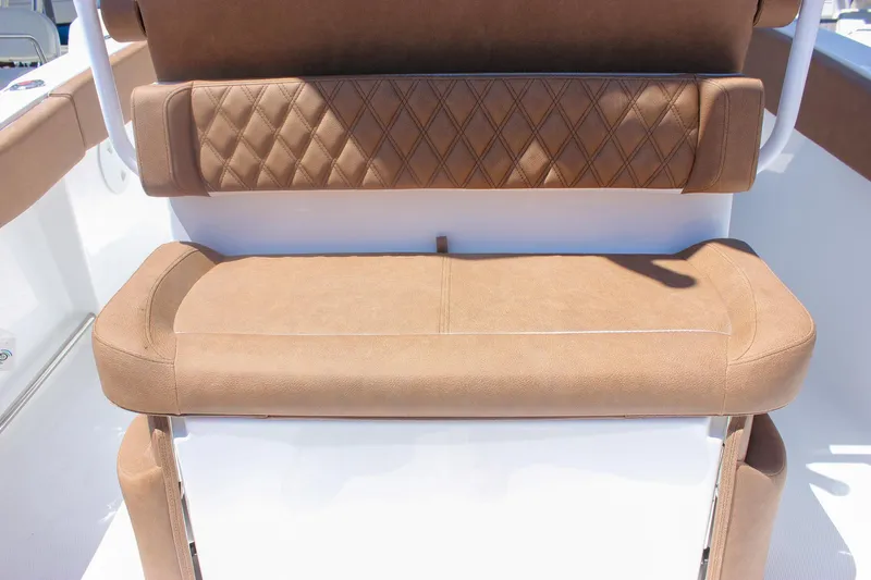 Slide: The Image of 2026 Sea Hunt Ultra 245 SE boat seat with brown cushioned upholstery. - 8