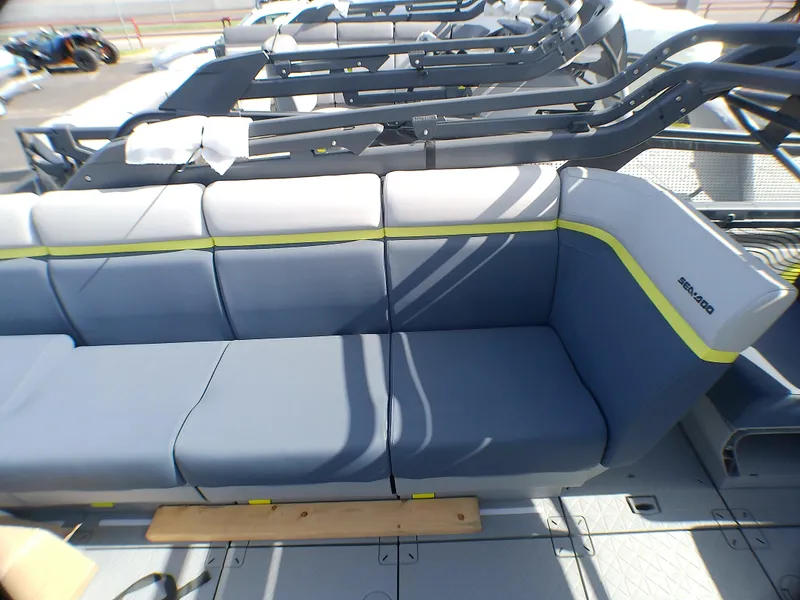 Slide: The Image of 2025 Sea-Doo 55SL boat seating with blue and gray upholstery, featuring modern design. - 10