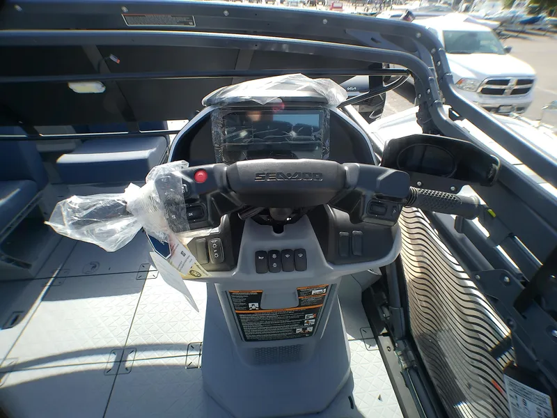 Slide: The Image of 2025 Sea-Doo 55SL dashboard with steering controls and display screen. - 11