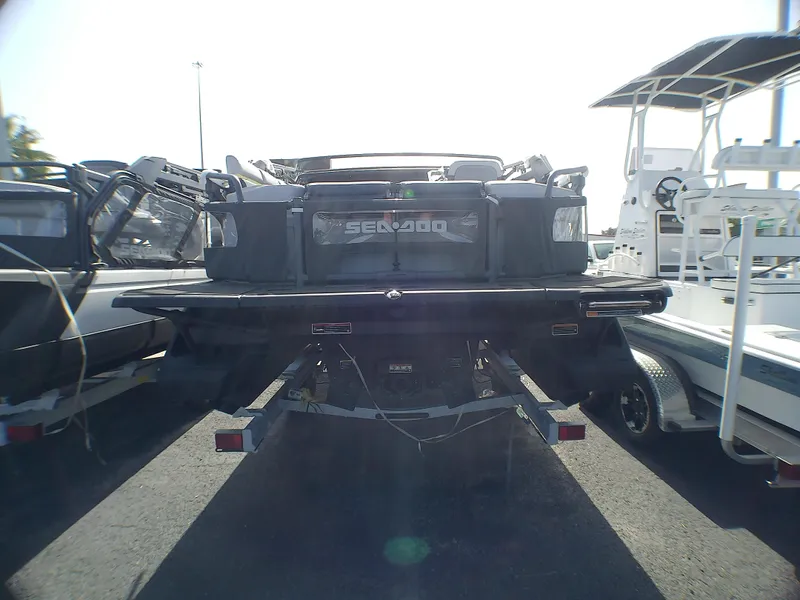 Slide: The Image of 2025 Sea-Doo 55SL watercraft on trailer, rear view in a parking lot. - 15
