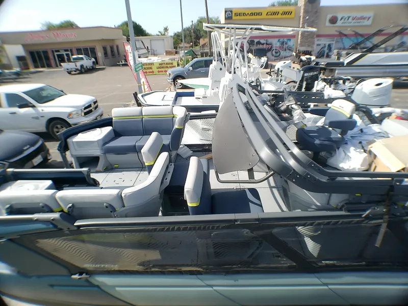 Slide: The Image of 2025 Sea-Doo 55SL boat with spacious seating, displayed at a marine dealership. - 3
