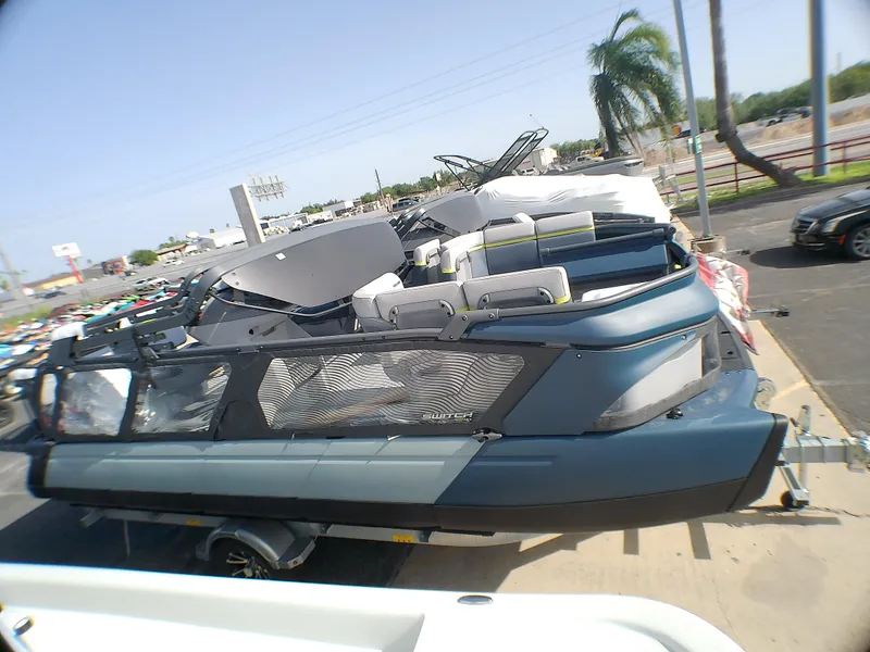 Slide: The Image of 2025 Sea-Doo 55SL boat on trailer, parked outdoors, showcasing sleek design and modern features. - 5