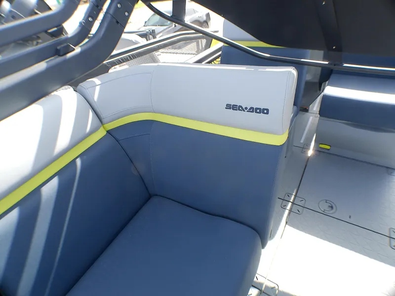 Slide: The Image of 2025 Sea-Doo 55SL interior with blue and gray seating, featuring yellow accents. - 9