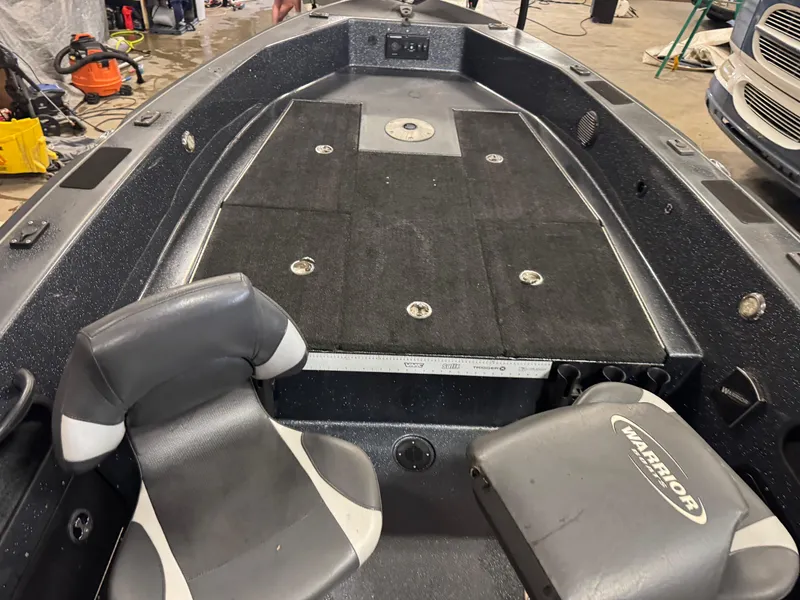 Slide: The Image of 2017 Warrior V2090 boat interior with seating and storage compartments. - 10