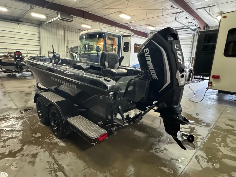 Slide: The Image of 2017 Warrior V2090 boat with Evinrude engine in a garage setting. - 3