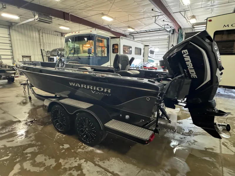 Slide: The Image of 2017 Warrior V2090 boat with Evinrude motor in a garage setting. - 4