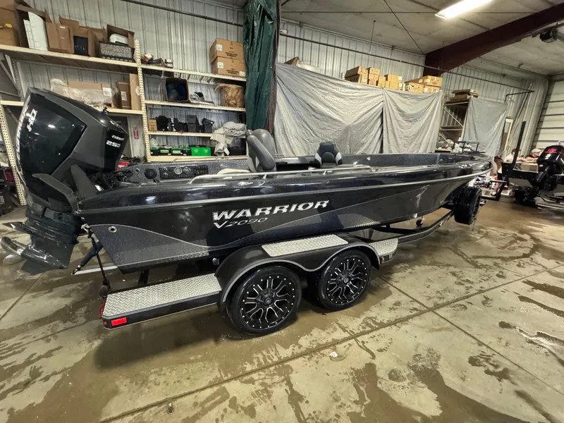 Slide: The Image of 2017 Warrior V2090 boat in a garage, featuring a powerful Evinrude 250 engine. - 5
