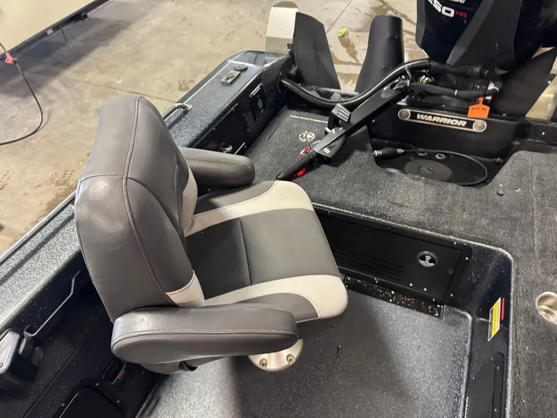 Slide: The Image of 2017 Warrior V2090 boat interior with swivel seat and motor controls. - 6