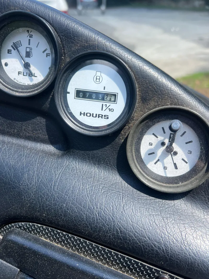Slide: The Image of Dashboard gauges of a 1997 Correct Craft Ski Nautique 196 boat. - 6