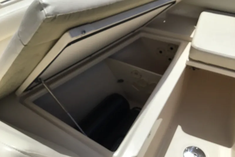 Slide: The Image of Open storage compartment on 2022 Grady-White Freedom 325 boat. - 32