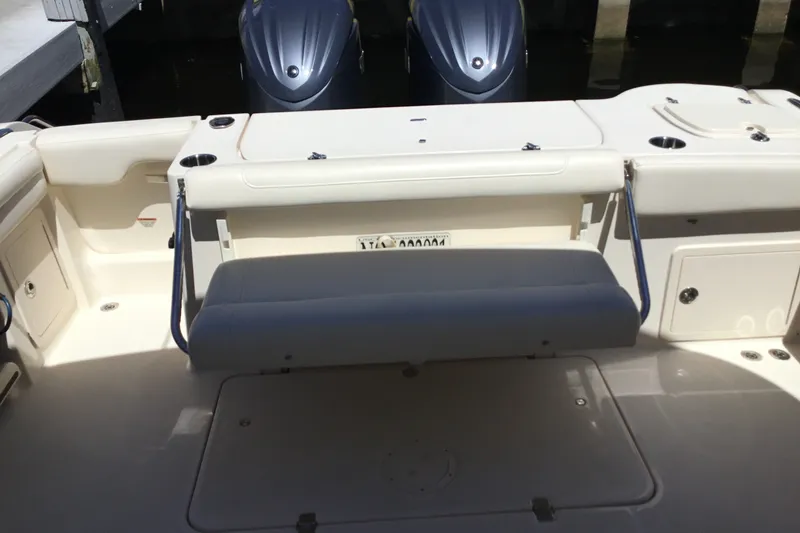 Slide: The Image of 2022 Grady-White Freedom 325 boat interior with seating and dual engines. - 69