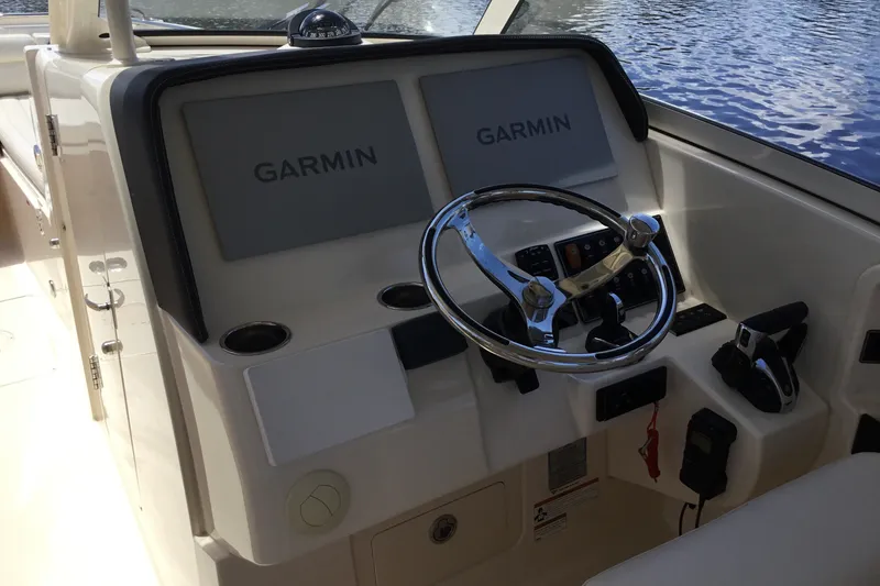Slide: The Image of Cockpit of 2022 Grady-White Freedom 325 boat with Garmin navigation system. - 48
