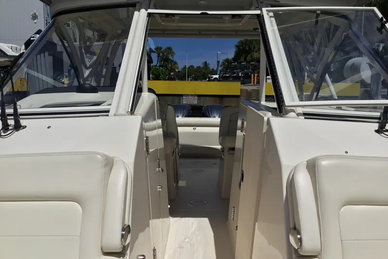 Slide: The Image of 2022 Grady-White Freedom 325 boat interior with open cockpit and seating. - 34