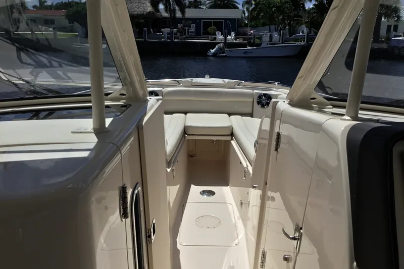 Slide: The Image of 2022 Grady-White Freedom 325 boat interior with seating and water view. - 35