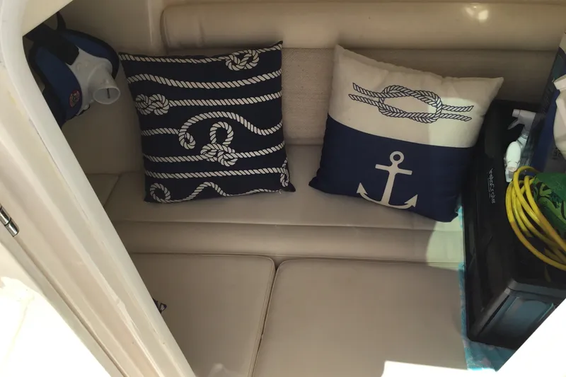 Slide: The Image of Cozy cabin interior of 2022 Grady-White Freedom 325 with nautical-themed cushions. - 38