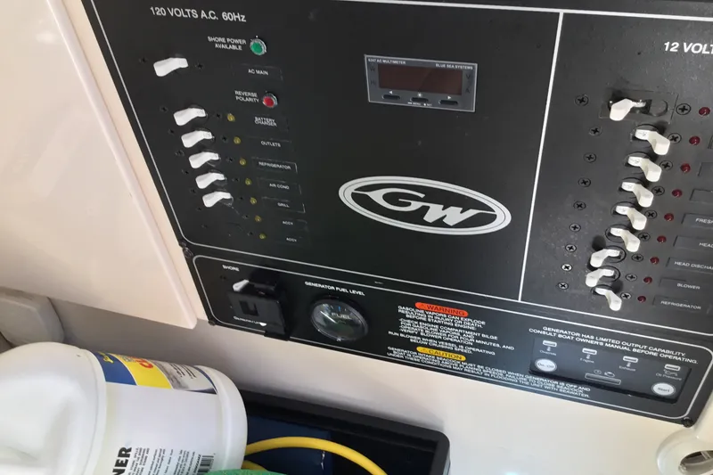 Slide: The Image of Control panel of a 2022 Grady-White Freedom 325 boat with switches and indicators. - 39