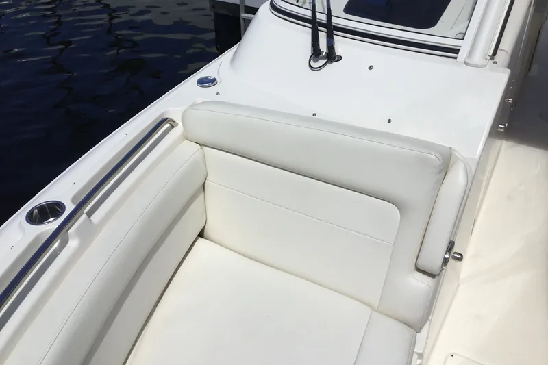 Slide: The Image of 2022 Grady-White Freedom 325 boat interior with white seating and stainless steel accents. - 28