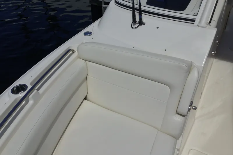 Slide: The Image of 2022 Grady-White Freedom 325 boat with white cushioned seating and stainless steel cup holder. - 29