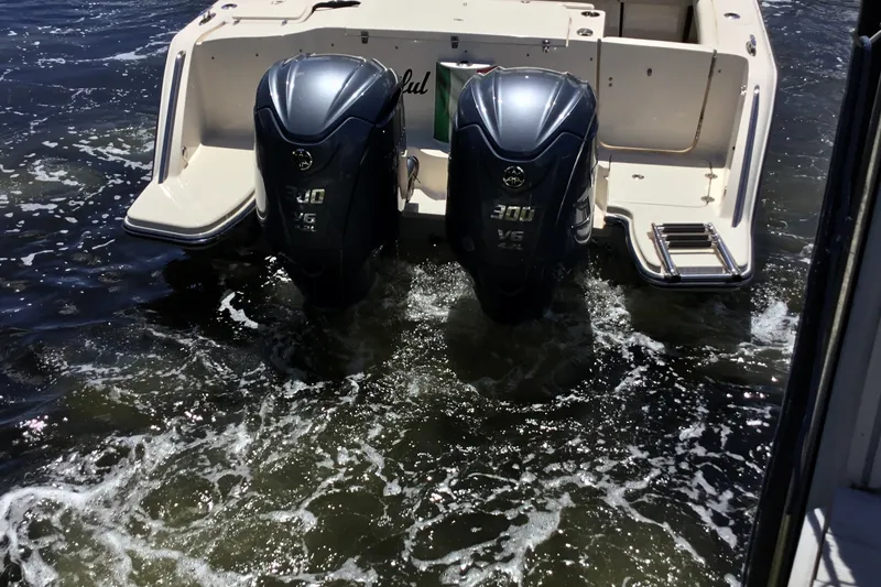 Slide: The Image of 2022 Grady-White Freedom 325 boat with dual Yamaha 300 V6 engines in water. - 21