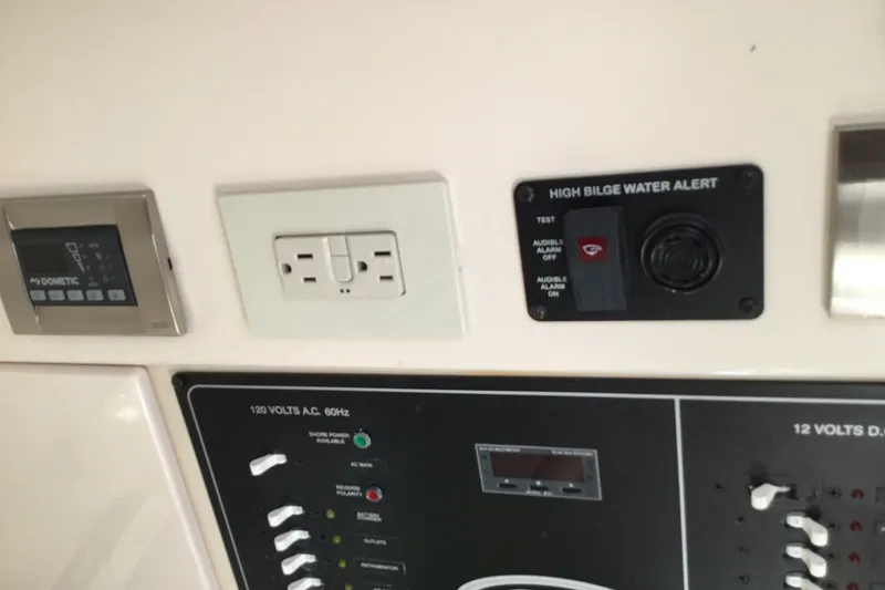Slide: The Image of Control panel of 2022 Grady-White Freedom 325 boat with high bilge water alert. - 40
