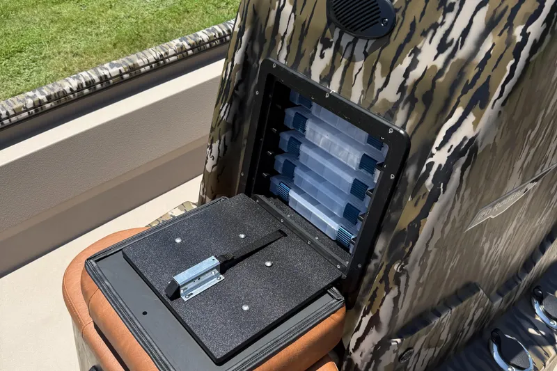 Slide: The Image of Storage compartment on 2026 Avid 20 ROGUE CC boat with camouflage design. - 10
