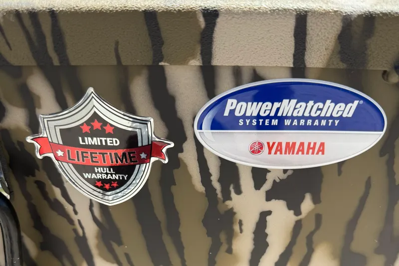 Slide: The Image of Limited lifetime hull warranty and Yamaha PowerMatched system warranty stickers on Avid 20 ROGUE CC 2026. - 12