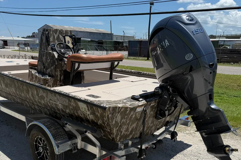 Slide: The Image of 2026 Avid 20 ROGUE CC boat with Yamaha 150 engine on a trailer. - 2