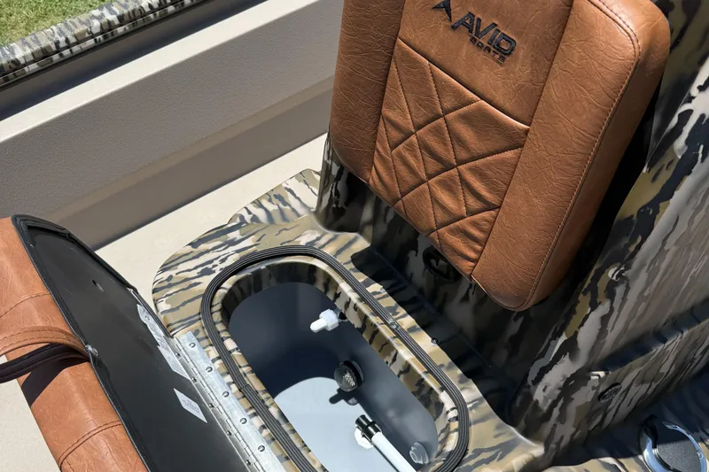 Slide: The Image of Avid 20 ROGUE CC 2026 boat seat with storage compartment, brown leather upholstery. - 6