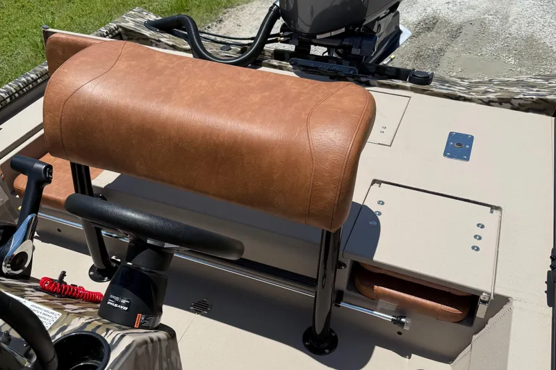 Slide: The Image of 2026 Avid 20 ROGUE CC boat interior with tan leather seating and steering console. - 8