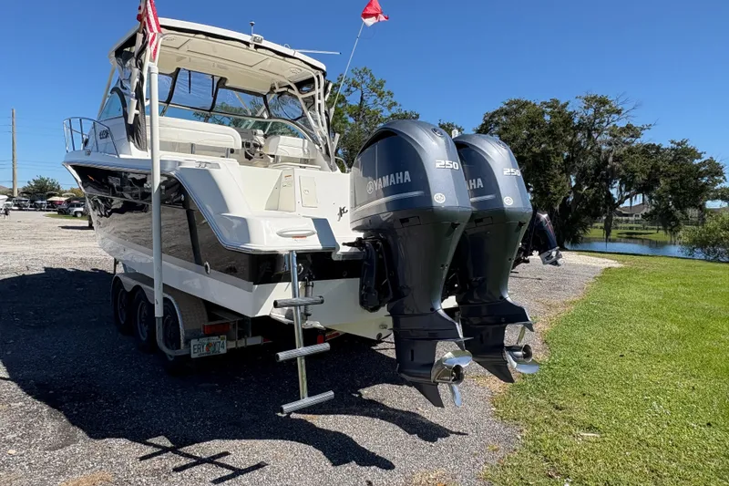 Slide: The Image of 2015 Wellcraft 290 Coastal boat with twin Yamaha 250 engines on a trailer. - 22