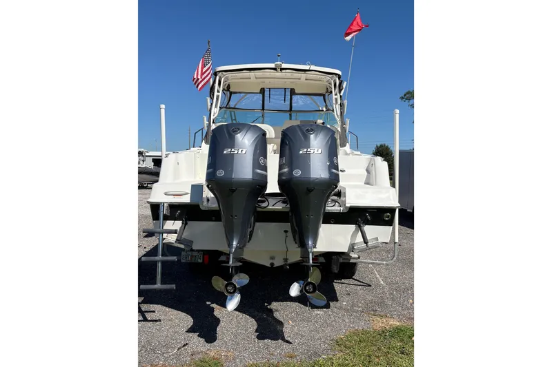 Slide: The Image of 2015 Wellcraft 290 Coastal boat with dual Yamaha 250 outboard engines. - 23