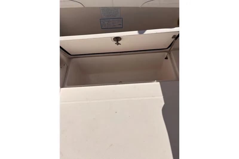 Slide: The Image of Open storage compartment on 2015 Wellcraft 290 Coastal boat. - 27