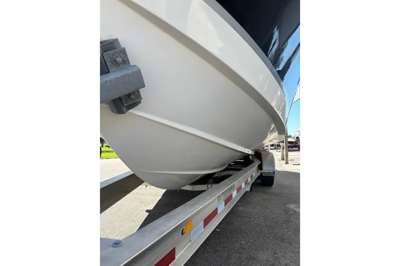 Slide: The Image of 2015 Wellcraft 290 Coastal boat on trailer, close-up view of hull. - 36
