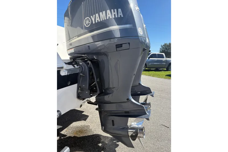 Slide: The Image of Yamaha outboard motor on a 2015 Wellcraft 290 Coastal boat, parked outdoors. - 37
