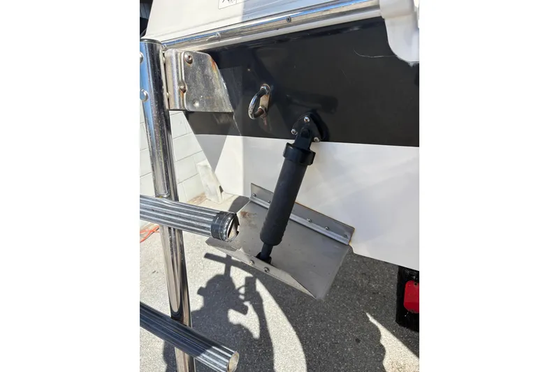 Slide: The Image of 2015 Wellcraft 290 Coastal boat ladder and trim tab detail. - 38