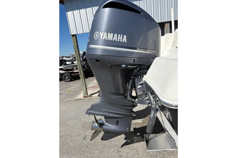 Slide: The Image of Yamaha outboard motor on 2015 Wellcraft 290 Coastal boat, parked outdoors. - 39
