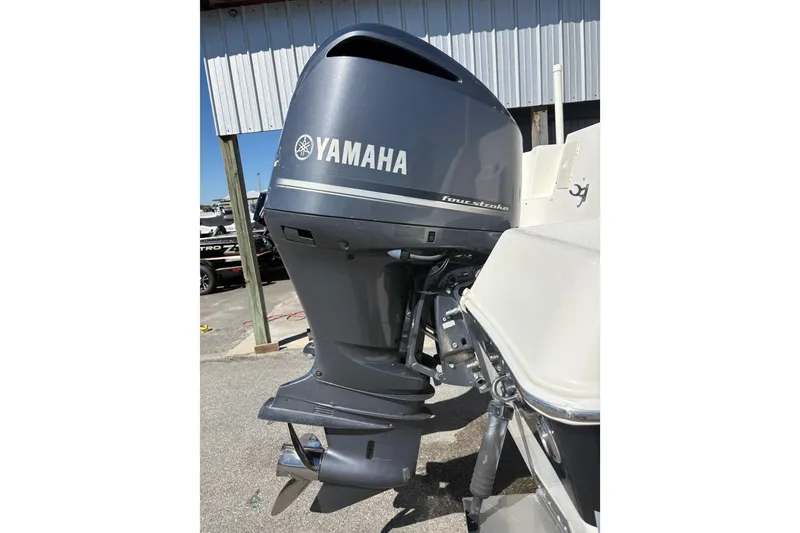 Slide: The Image of Yamaha outboard motor on 2015 Wellcraft 290 Coastal boat, docked outdoors. - 40